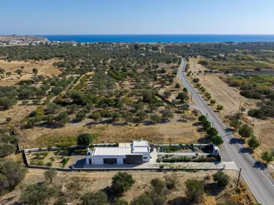an aerial view of a house with a road at Villa Galini in Haraki