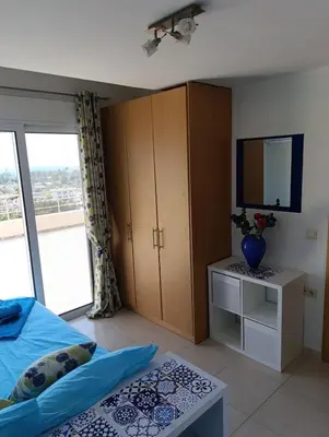 a bedroom with a bed and a tv on a cabinet at Villa Klelia in Afantou