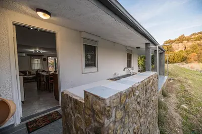 a kitchen with a stone counter top on a house at Villa Hara Kiotari in Gennadi