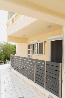 a fence in front of a house at Filoxenia City Escape in Rhodes Town