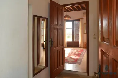 an open door to a hallway with a hallway leading into a house at Amphora Sea View Pefkos in Pefki Rhodes