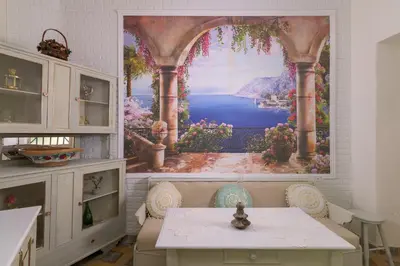a room with a large painting of a window at Kyramarias Village house in Malona Village
