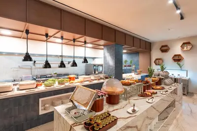 a large kitchen with a buffet of food at Alizo Comfort Chic Stay Rhodes - Adults Only in Ixia