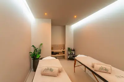 two beds in a room with lights on the ceiling at Alizo Comfort Chic Stay Rhodes - Adults Only in Ixia