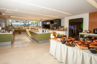 a restaurant with a buffet of food on display at Rhodos Horizon Marina - Adults Only in Rhodes Town