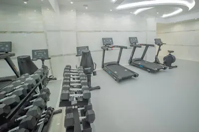 an empty gym with cardio equipment in a room at Rhodos Horizon Marina - Adults Only in Rhodes Town
