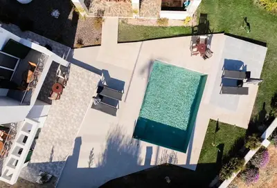 an overhead view of a swimming pool in a backyard at Villa Kiki, Kiotari in Asklipiḯon