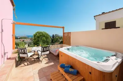 a hot tub on the deck of a house at Nikos Takis Boutique Fashion hotel in Rhodes Town