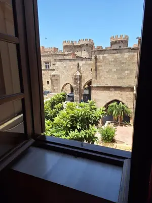 a view of a castle from a window at Nikos Takis Boutique Fashion hotel in Rhodes Town
