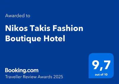 a blue sign with the text nikos takes fashion boutique hotel at Nikos Takis Boutique Fashion hotel in Rhodes Town