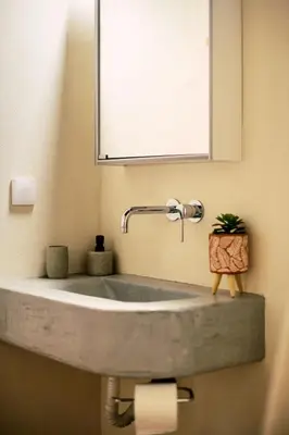 a sink in a bathroom with a mirror at Nora's ixia summer house in Ialyssos