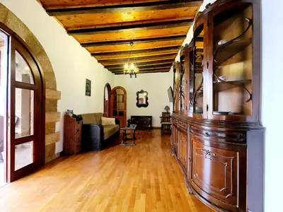 a large living room with a wooden ceiling at Shades of Wood Old Town in Rhodes Town