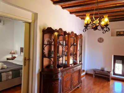 a large wooden cabinet in a room with a bed at Shades of Wood Old Town in Rhodes Town