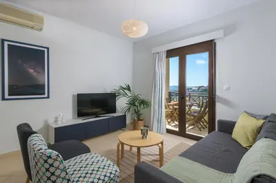 a living room with a couch and a tv at Rodini Anassa in Rhodes Town