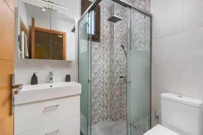 a bathroom with a sink and a shower at Rodini Anassa in Rhodes Town