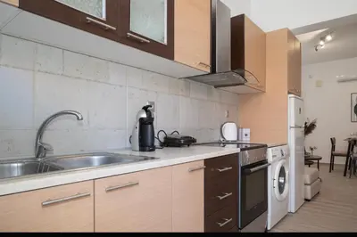 a kitchen with a sink and a dishwasher at Filerimos City Center Apt in Ialysos Rhodes in Ialyssos