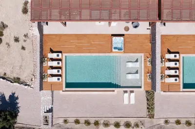 an overhead view of a building with a swimming pool at Under The Sun on Faliraki Hill in Kalithies