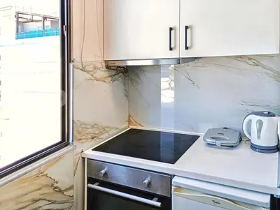 a kitchen with a sink and a counter top at 7-Modern city center studio with sea view! in Rhodes Town