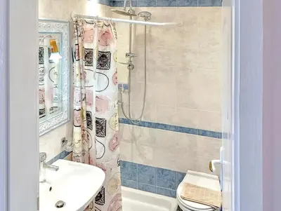 a bathroom with a sink and a toilet and a shower at 7-Modern city center studio with sea view! in Rhodes Town