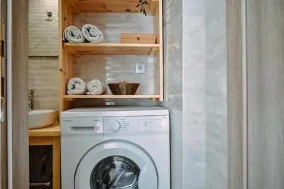 a washer and dryer in a small bathroom at Melograno di Rodi 7 in Rhodes Town