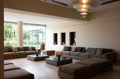 a large living room with couches and tables at Blue Bay Beach Resort in Ialyssos