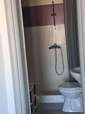a bathroom with a shower and a toilet at House of Happiness in Kritinía