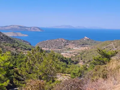 a view of the ocean from the hills at House of Happiness in Kritinía