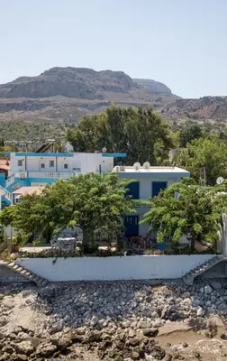 a house with trees in front of it at Villa Amalia in Vrachonisída touArchangélou