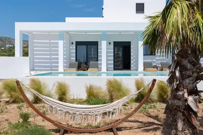a hammock in front of a villa at Seashell Villa - Luxury Pool Retreat - 150m Beach in Lachania
