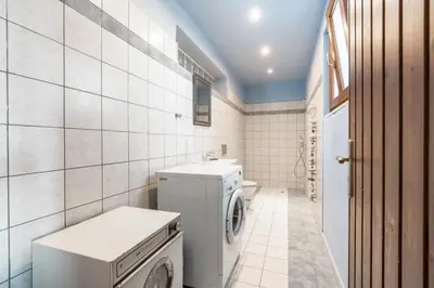 a bathroom with a washer and dryer in it at Rhodes Retreat in Kalithies