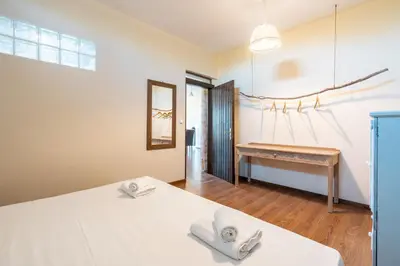 a room with a bed and a table in it at Rhodes Retreat in Kalithies