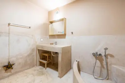 a bathroom with a sink and a shower at Rhodes Retreat in Kalithies