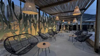 a group of chairs and tables in a patio at LA Casa Di Lusso Casa N2 Adults Only in Kolimbia