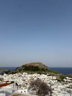 a view of a town with white buildings on a hill at V&G Cozy Home, Pilona Village in vlicha