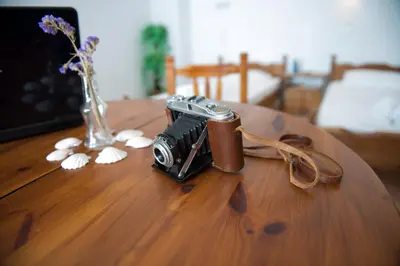 a camera sitting on top of a wooden table at Lindos Center Studios in Líndos