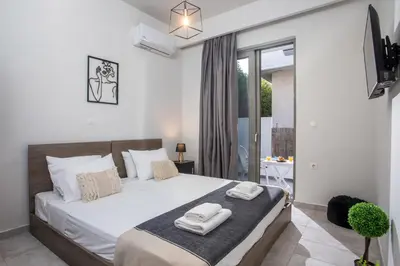 a bedroom with a bed with two towels on it at Ixia del Mar Apartment in Ixia