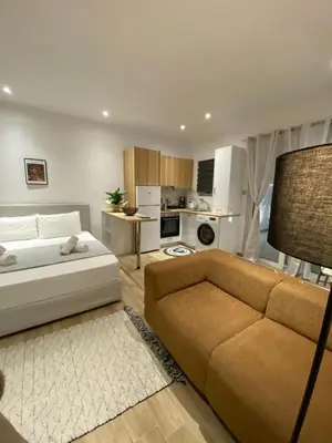 a living room with a bed and a couch at Melograno di Rodi 8 in Rhodes Town