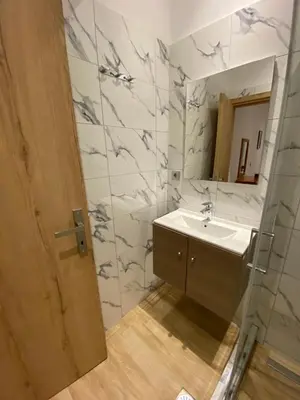 a bathroom with a sink and a mirror at Melograno di Rodi 8 in Rhodes Town