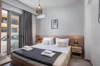 a bedroom with a bed with two towels on it at Ixia del sol Apartment in Ixia