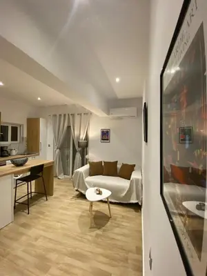 a living room with a couch and a table at Melograno di Rodi 9 in Rhodes Town