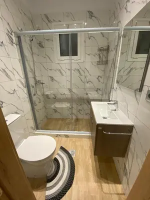 a bathroom with a shower and a toilet and a sink at Melograno di Rodi 9 in Rhodes Town
