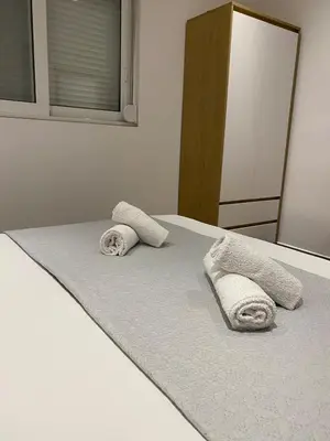 a bedroom with two towels on a bed at Melograno di Rodi 9 in Rhodes Town