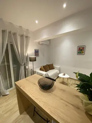 a living room with a couch and a table at Melograno di Rodi 9 in Rhodes Town