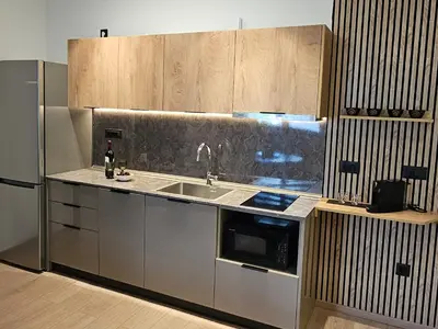 a kitchen with a sink and a microwave at S & E luxury city residences in Rhodes Town