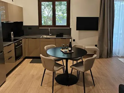 a kitchen with a table and chairs in a kitchen at S & E luxury city residences in Rhodes Town