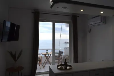 a room with a view of the ocean from a room at Eraya Apartment in Haraki