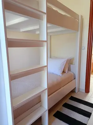 a bedroom with a bunk bed in a room at Sunny Palm Villa in Ialyssos