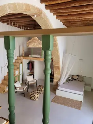 a room with a bed and a table at Makariospiti - Villa Vera in Malona Village