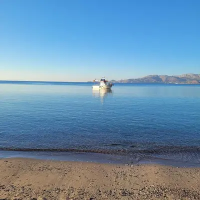 a boat in the middle of a large body of water at Makariospiti - Villa Vera in Malona Village