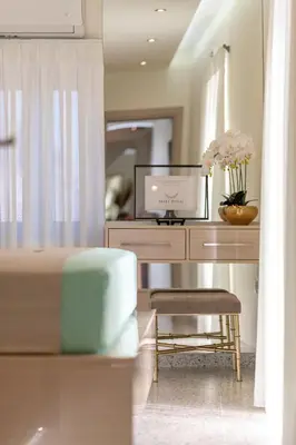 a room with a desk with a computer and a chair at Ελin Villa in Kalathos